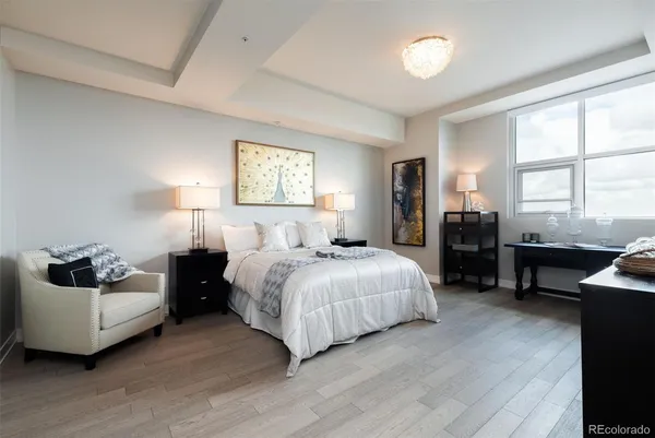 a bedroom with a bed and a couch