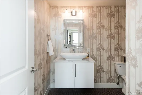 a bathroom with a sink a mirror and shower