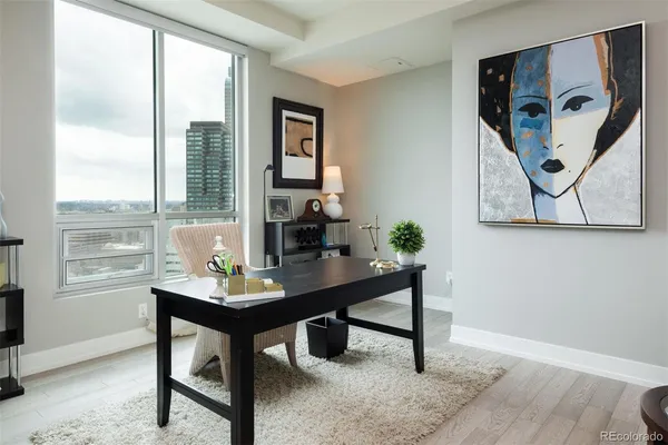 a workspace with furniture and window