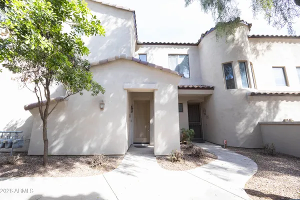 a view of a house with a yard and garage