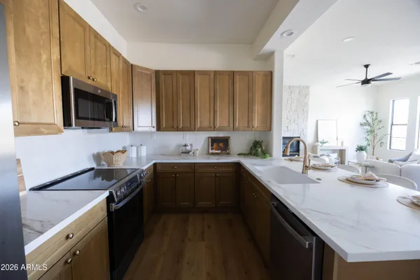 a kitchen with a sink and a potted plant