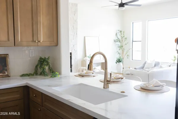 a bedroom with a bed and a potted plant