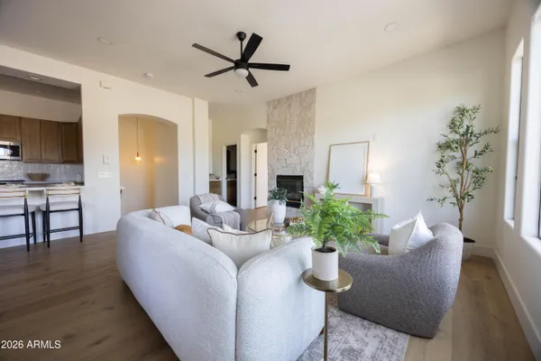 a living room with furniture and a fireplace