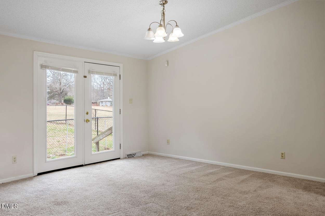 919 Red Mountain Road Rougemont, NC 27572 - Photo 12 of 32 an empty room with windows