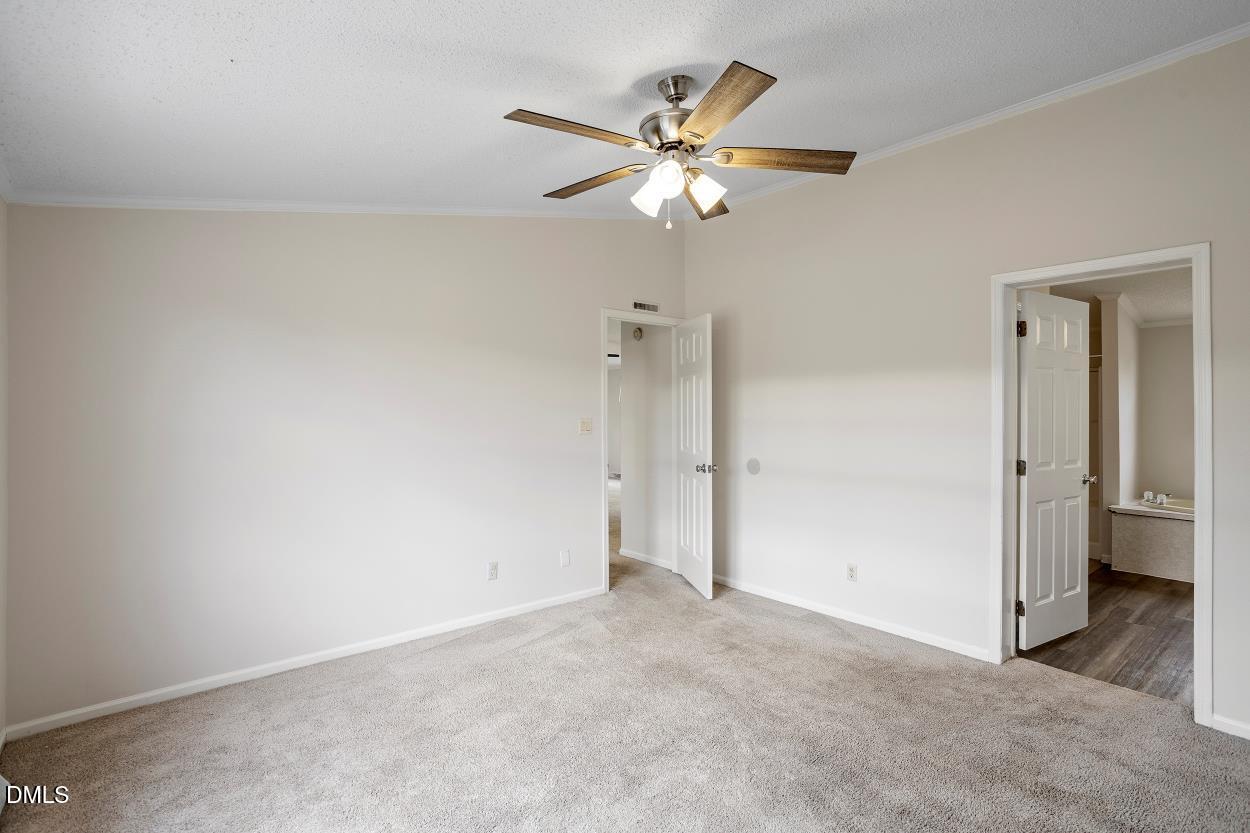 919 Red Mountain Road Rougemont, NC 27572 - Photo 19 of 32 a view of an empty room with a chandelier fan