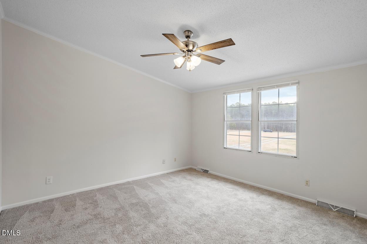 919 Red Mountain Road Rougemont, NC 27572 - Photo 20 of 32 a view of an empty room with a window