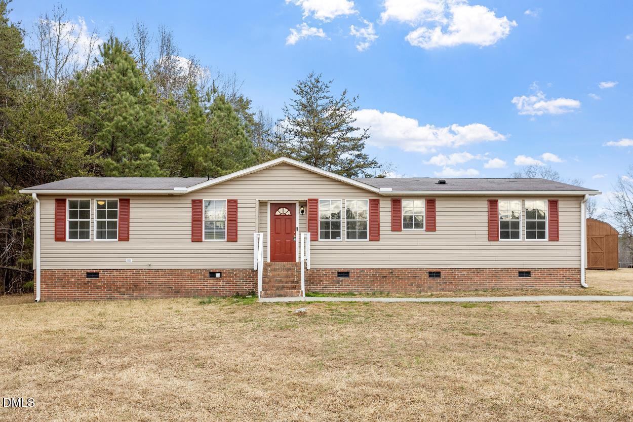 919 Red Mountain Road Rougemont, NC 27572 - Photo 2 of 32 a front view of a house with a yard
