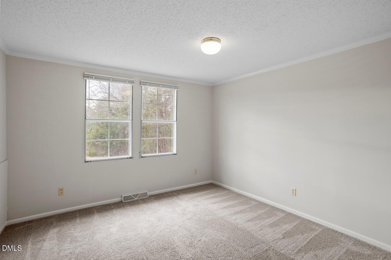 919 Red Mountain Road Rougemont, NC 27572 - Photo 23 of 32 an empty room with a window