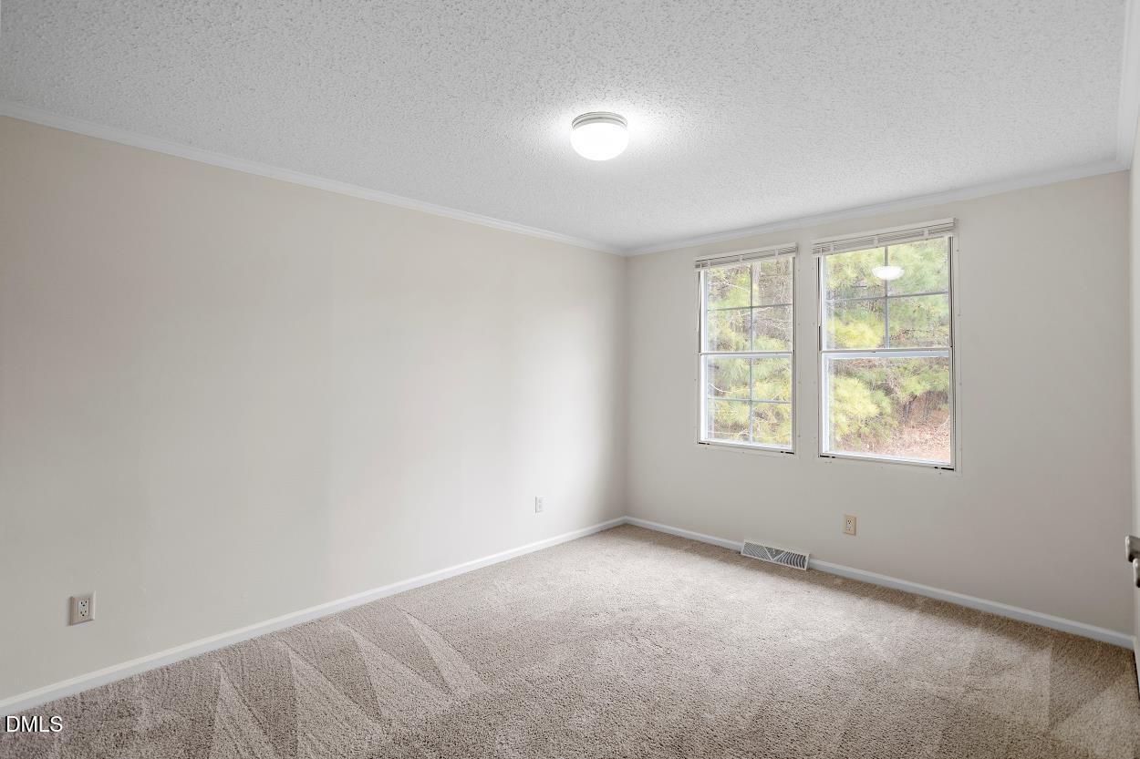 919 Red Mountain Road Rougemont, NC 27572 - Photo 24 of 32 an empty room with windows