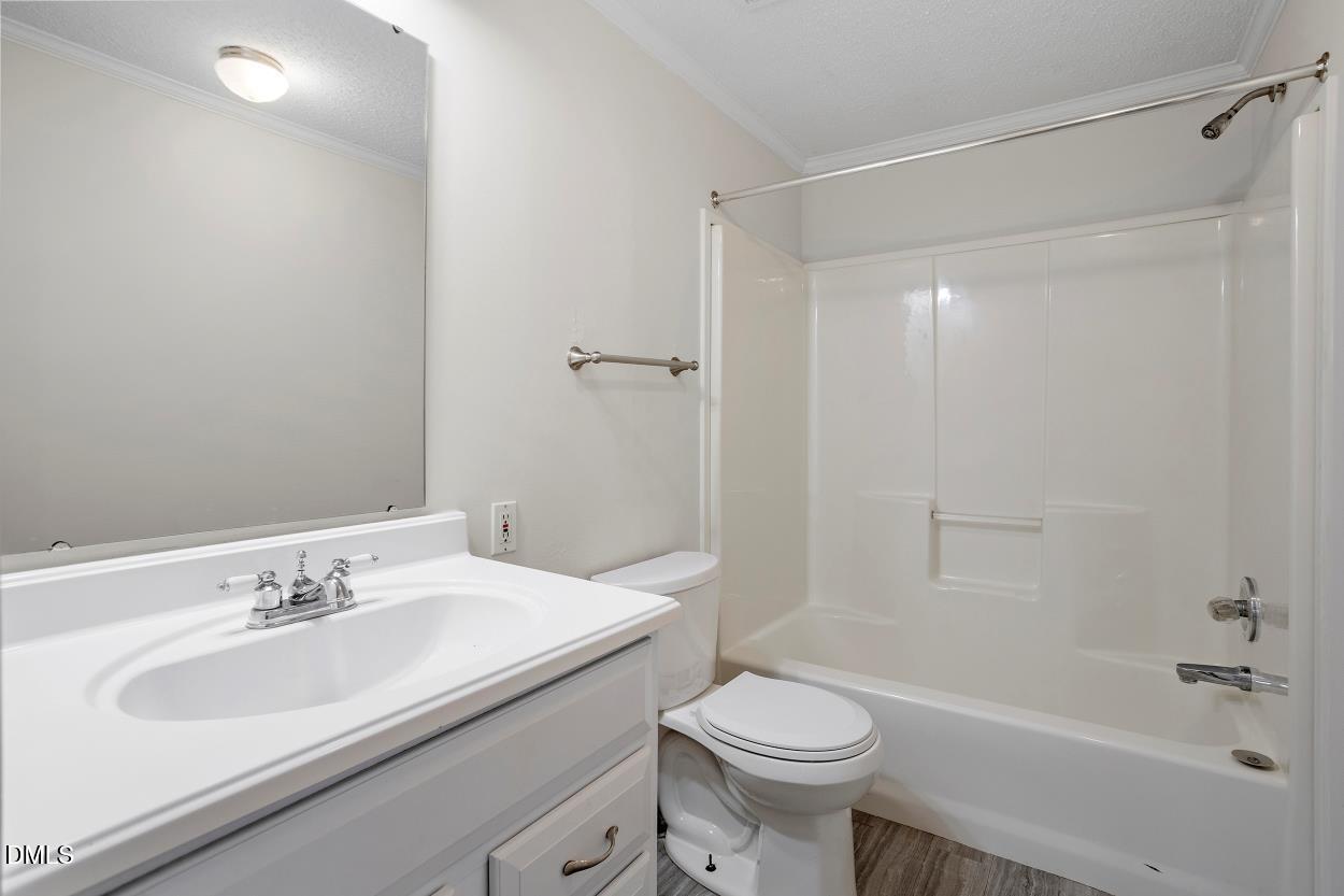 919 Red Mountain Road Rougemont, NC 27572 - Photo 26 of 32 a bathroom with a sink toilet and shower