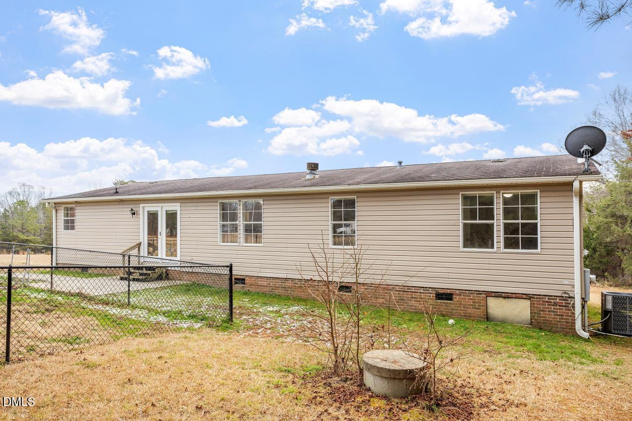919 Red Mountain Road Rougemont, NC 27572 - Photo 27 of 32 a backyard of a house with yard and outdoor seating