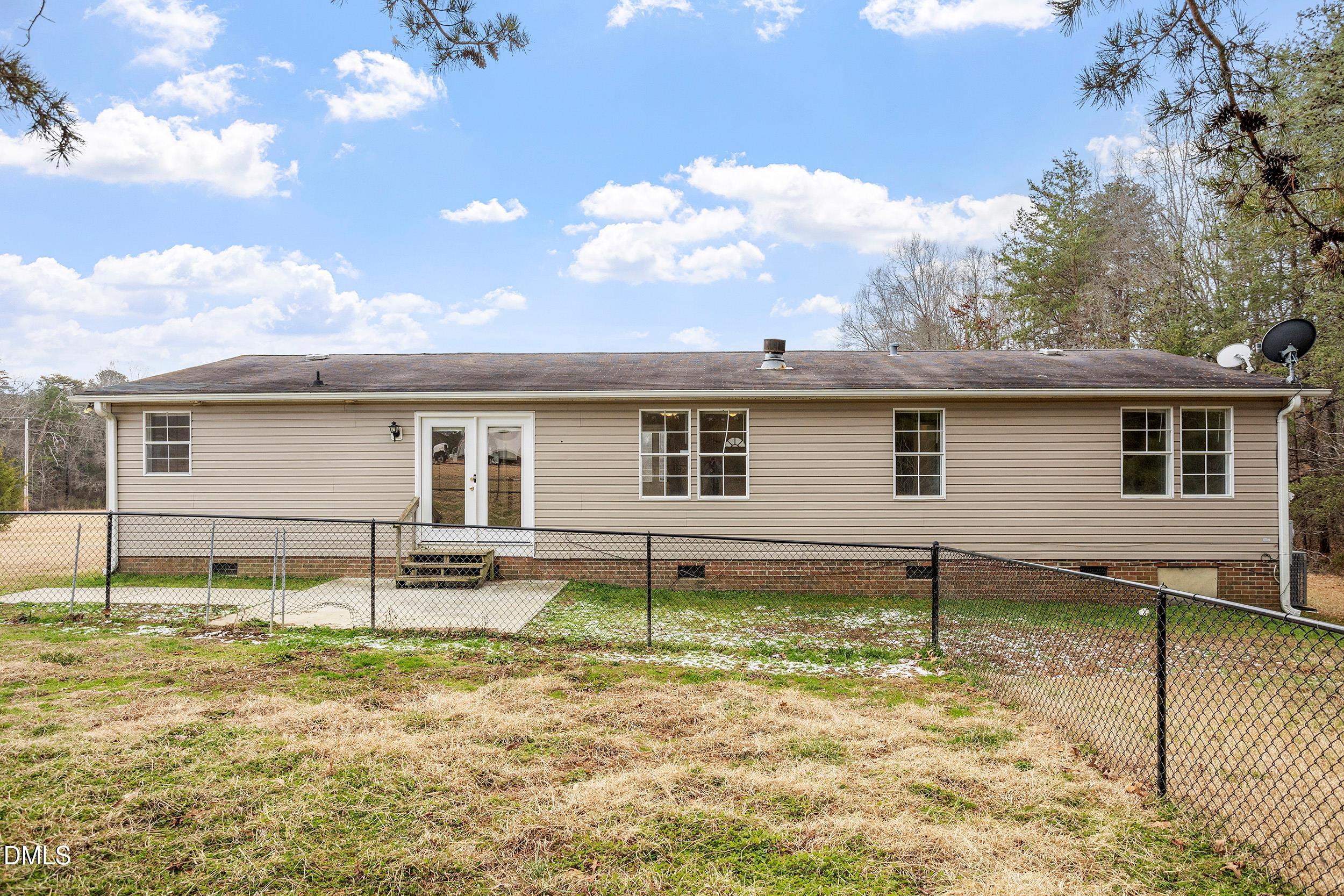 919 Red Mountain Road Rougemont, NC 27572 - Photo 28 of 32 front view of a house with a yard