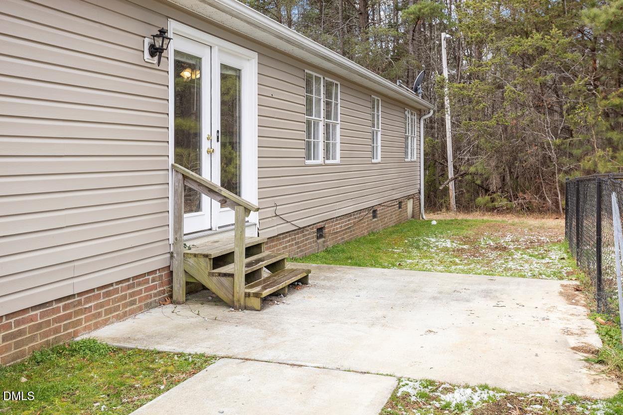 919 Red Mountain Road Rougemont, NC 27572 - Photo 29 of 32 a view of a house with a yard