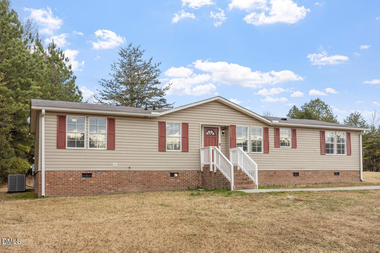 919 Red Mountain Road Rougemont, NC 27572 - Photo 3 of 32 a view of a house with a yard