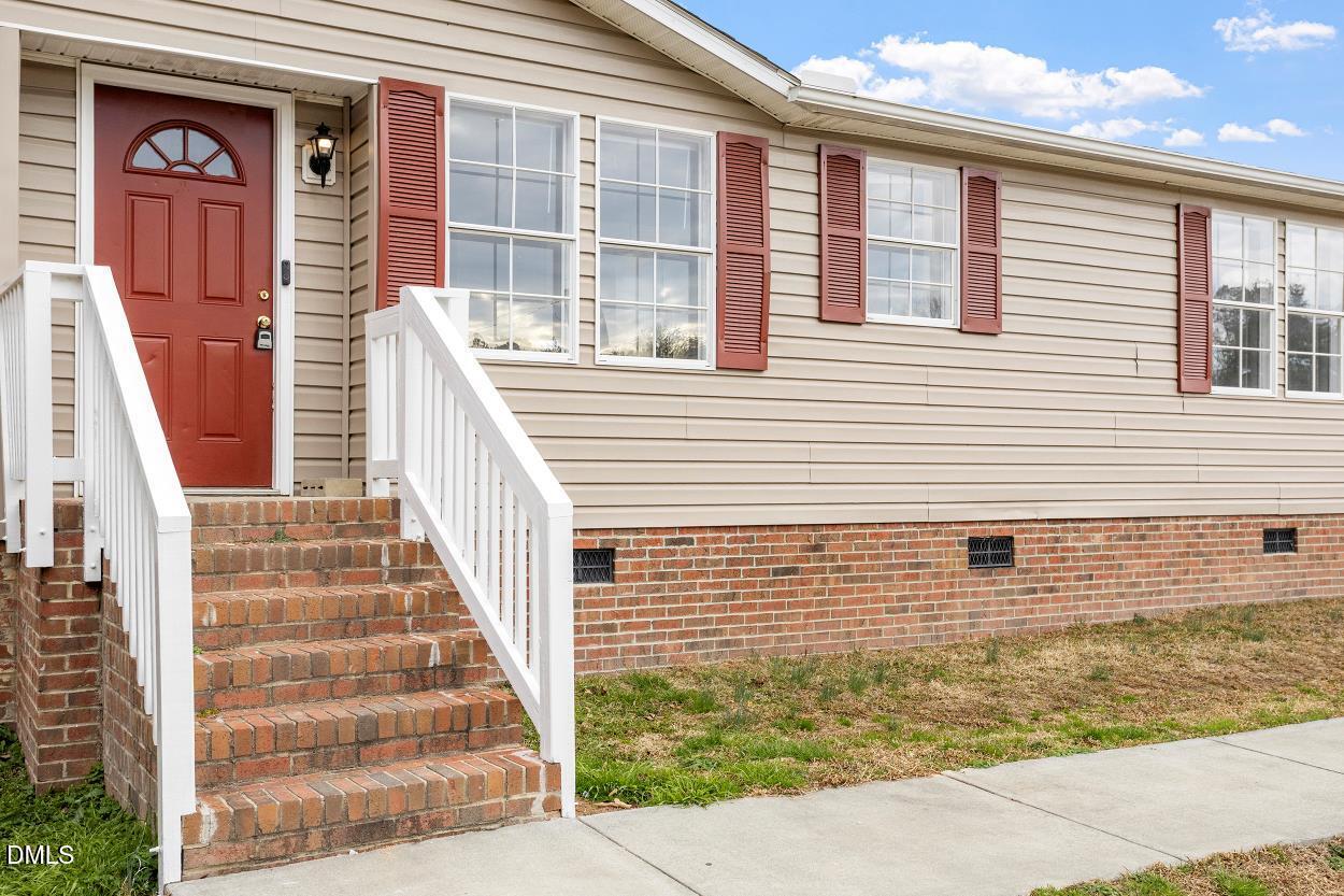 919 Red Mountain Road Rougemont, NC 27572 - Photo 5 of 32 a view of front door and small yard
