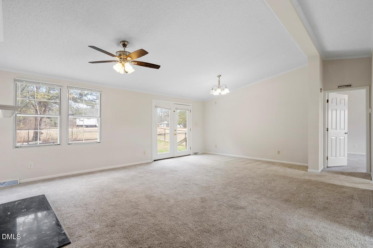 919 Red Mountain Road Rougemont, NC 27572 - Photo 8 of 32 a view of an empty room with a window