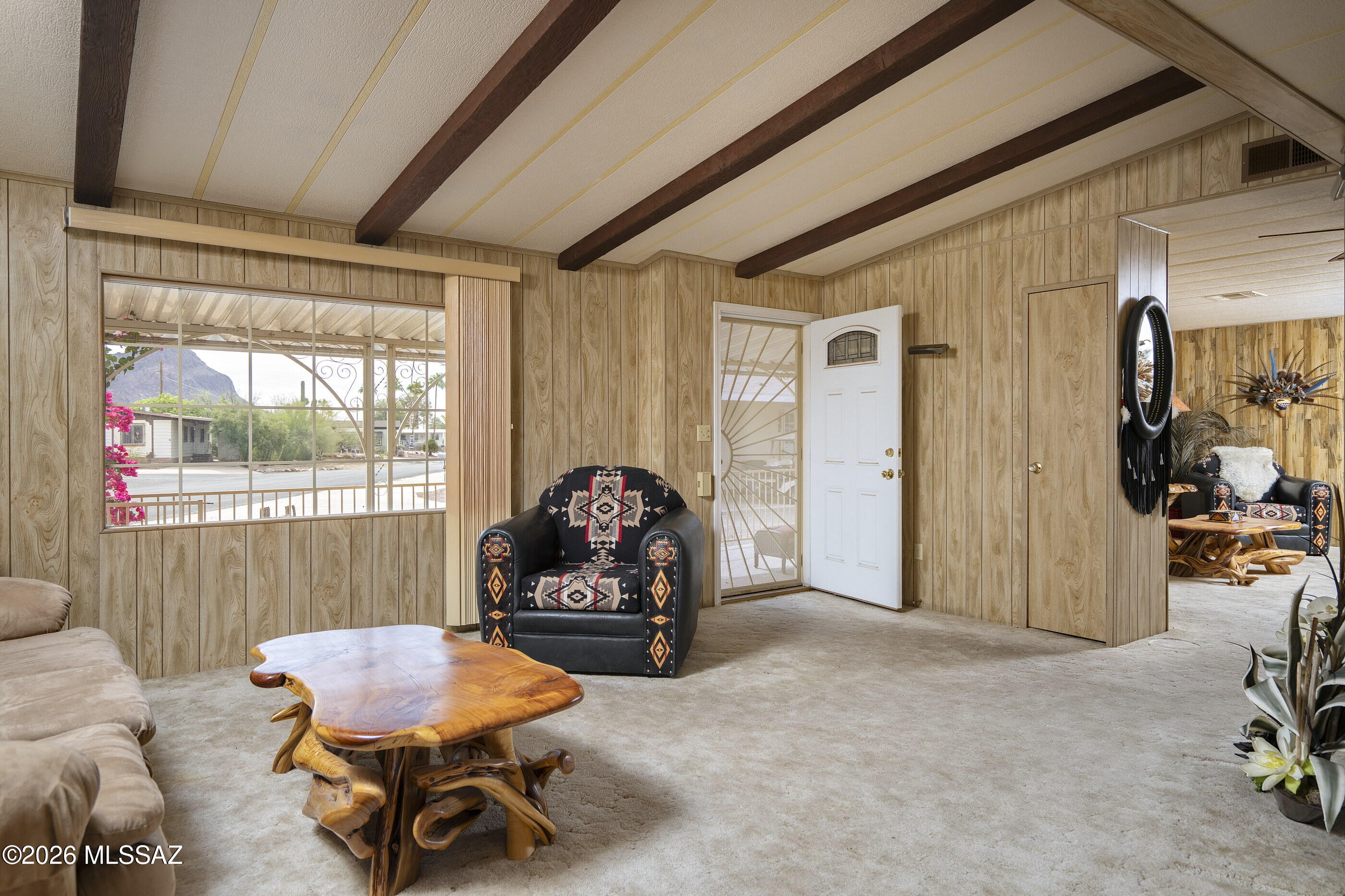 6121 West Flying M Street Tucson, AZ 85713 - Photo 6 of 25 a living room with furniture and a window