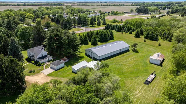 an aerial view of a house with garden space and outdoor seating