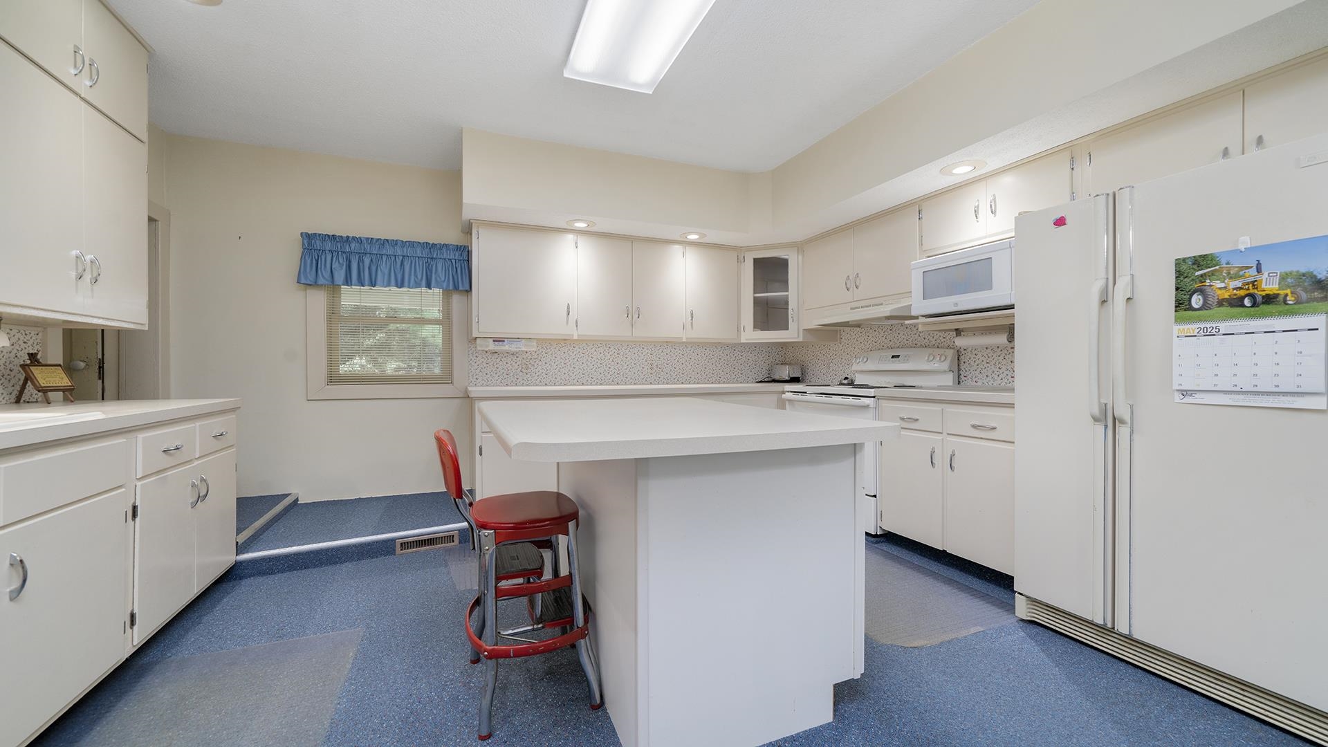 3910 Highway 64 Oregon, IL 61061 - Photo 16 of 53 a kitchen with white cabinets and sink