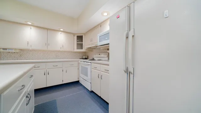 a bathroom with a sink a toilet and a window