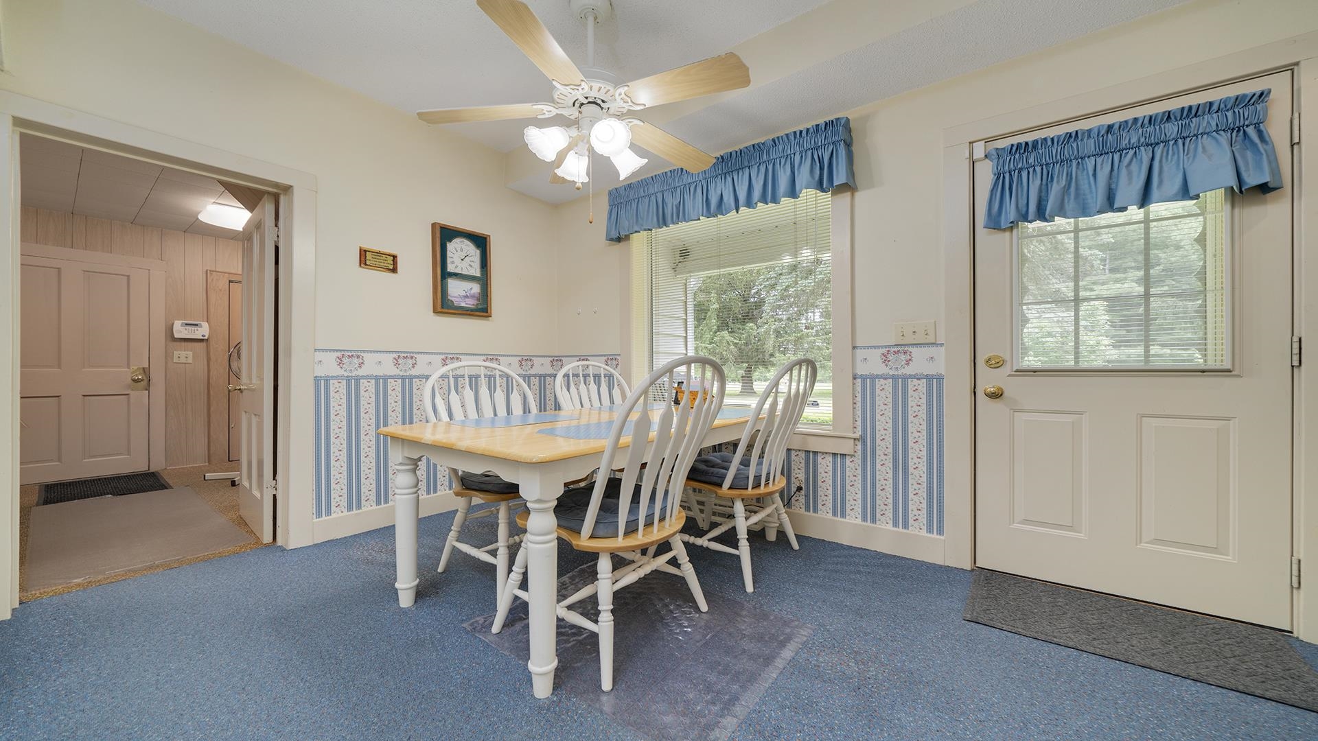 3910 Highway 64 Oregon, IL 61061 - Photo 21 of 53 a view of a dining room with furniture and a chandelier