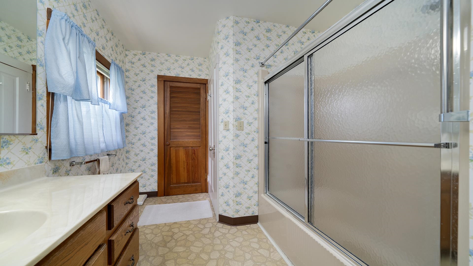 3910 Highway 64 Oregon, IL 61061 - Photo 26 of 53 a bathroom with a double vanity sink and a shower