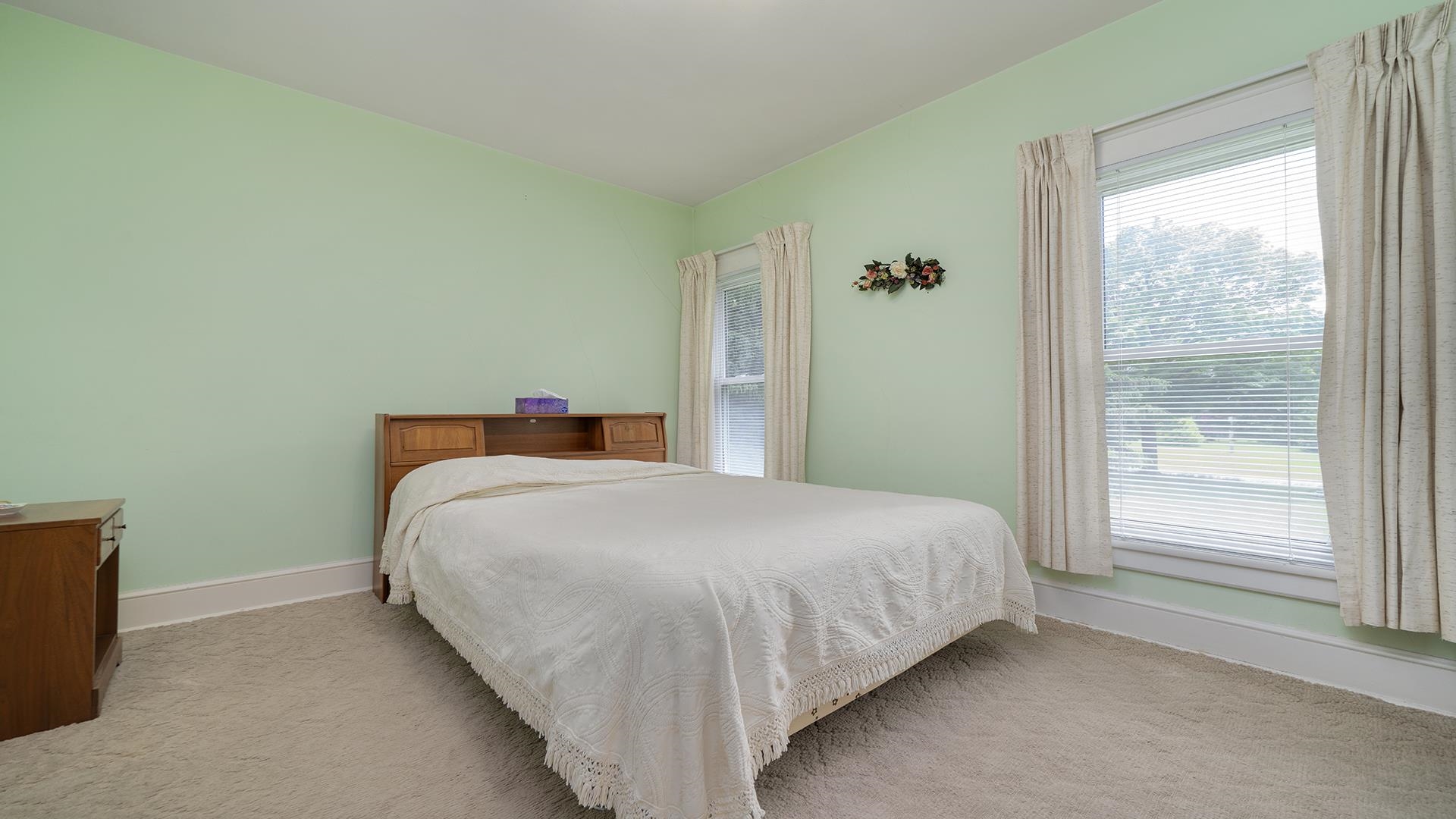 3910 Highway 64 Oregon, IL 61061 - Photo 27 of 53 a bedroom with a bed and window