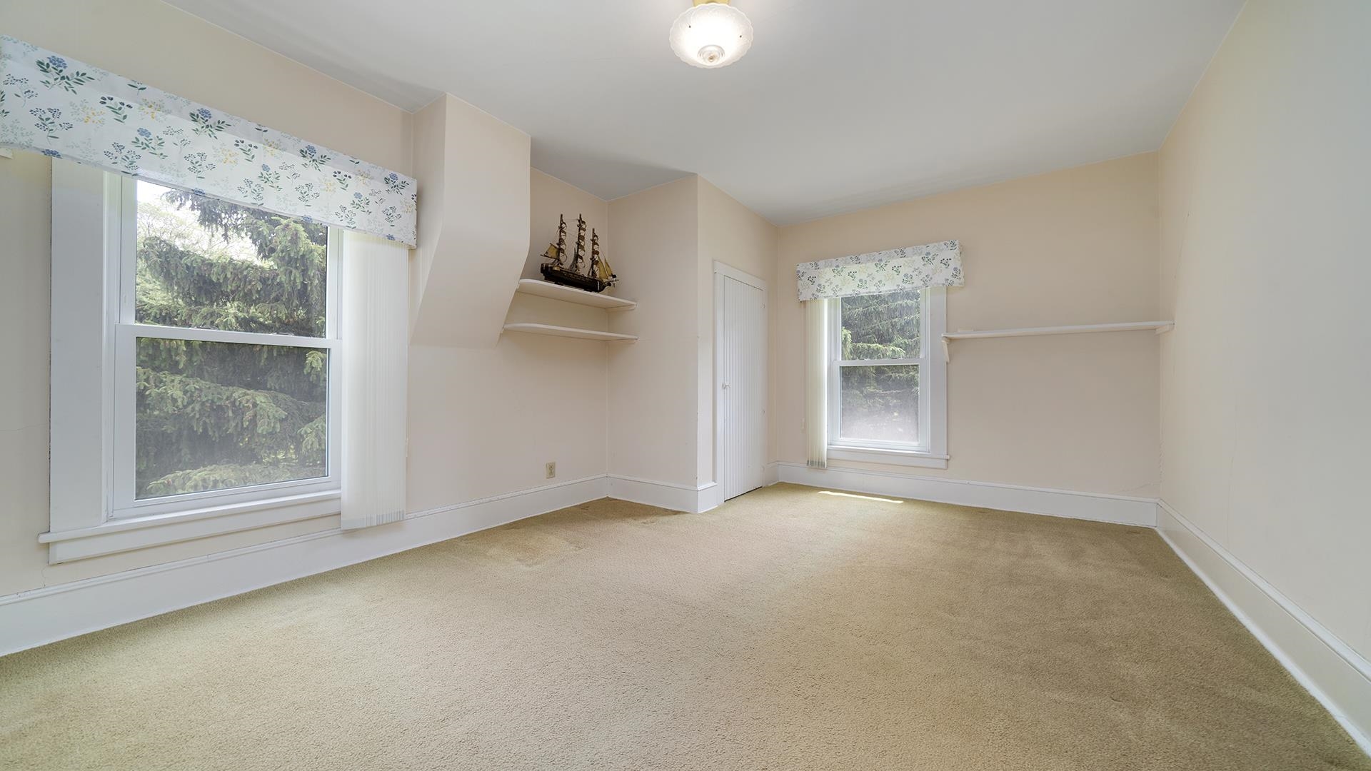 3910 Highway 64 Oregon, IL 61061 - Photo 29 of 53 an empty room with windows and closet