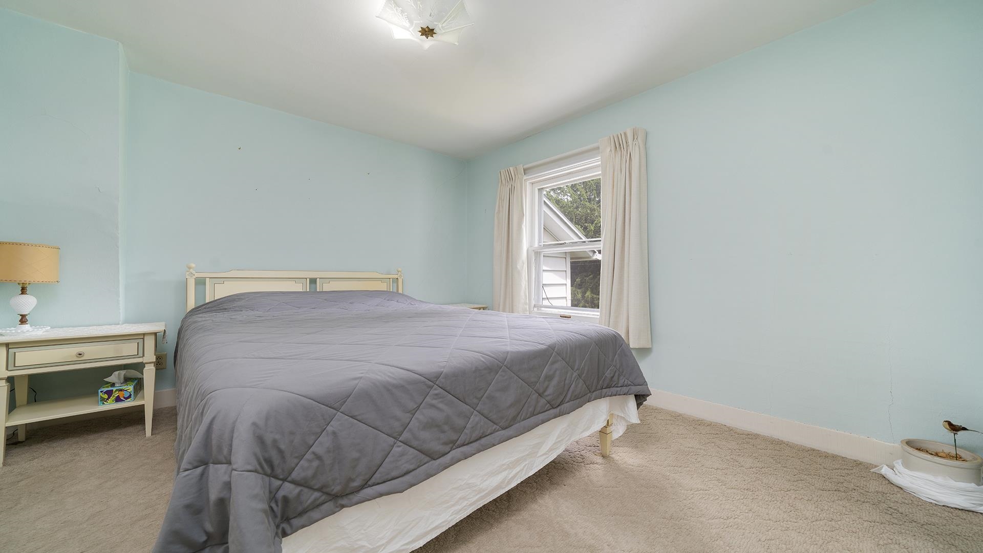 3910 Highway 64 Oregon, IL 61061 - Photo 31 of 53 a bed sitting in a bedroom next to a window