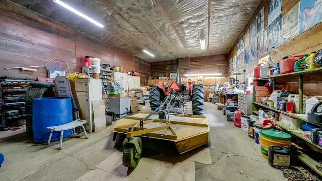 a view of a grassy field with trees in the background