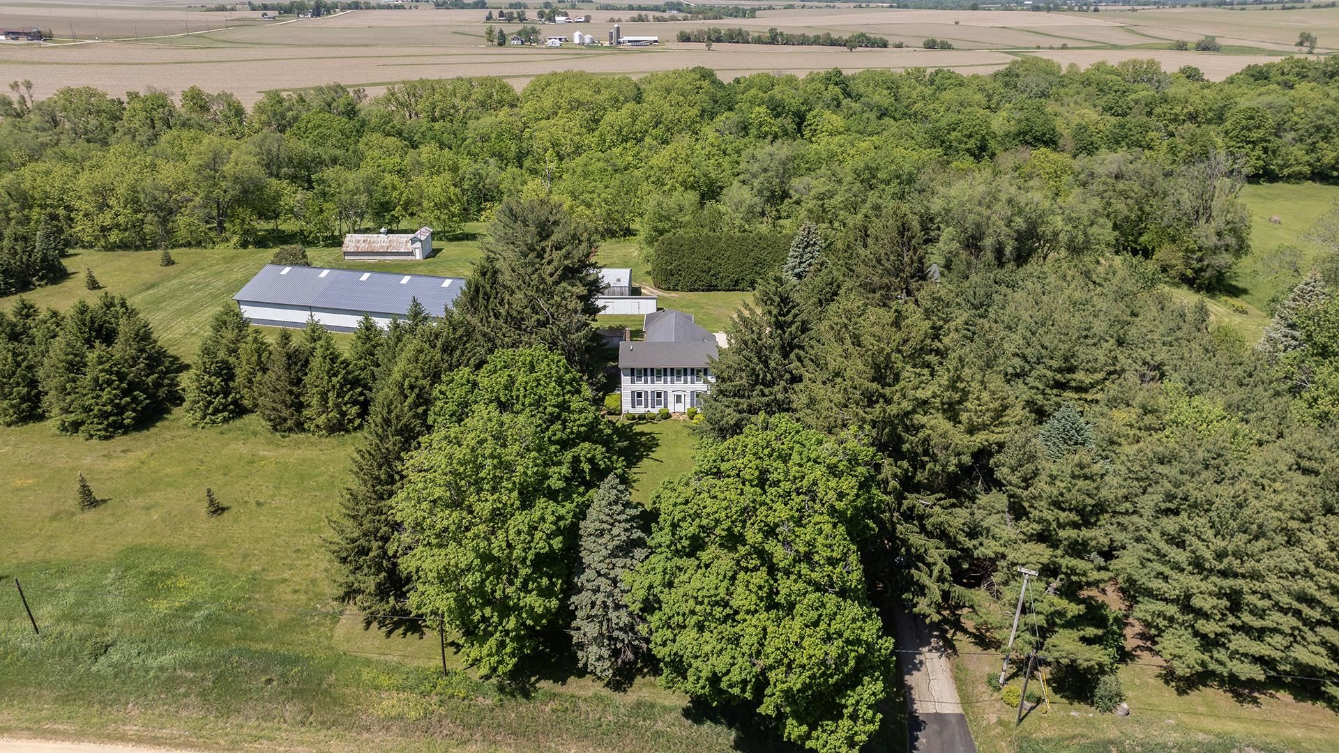 3910 Highway 64 Oregon, IL 61061 - Photo 4 of 53 a view of a yard with plants and large trees