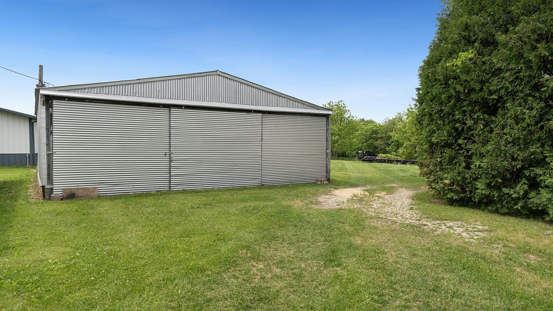 3910 Highway 64 Oregon, IL 61061 - Photo 42 of 53 a backyard of a house with lots of green space