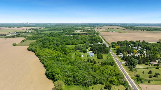 an aerial view of a houses with outdoor space and ocean view