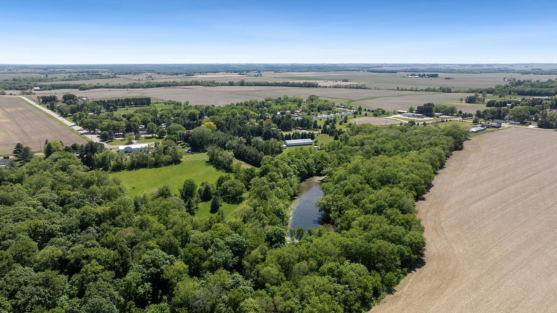 3910 Highway 64 Oregon, IL 61061 - Photo 7 of 53 an aerial view of a city and mountain view in back