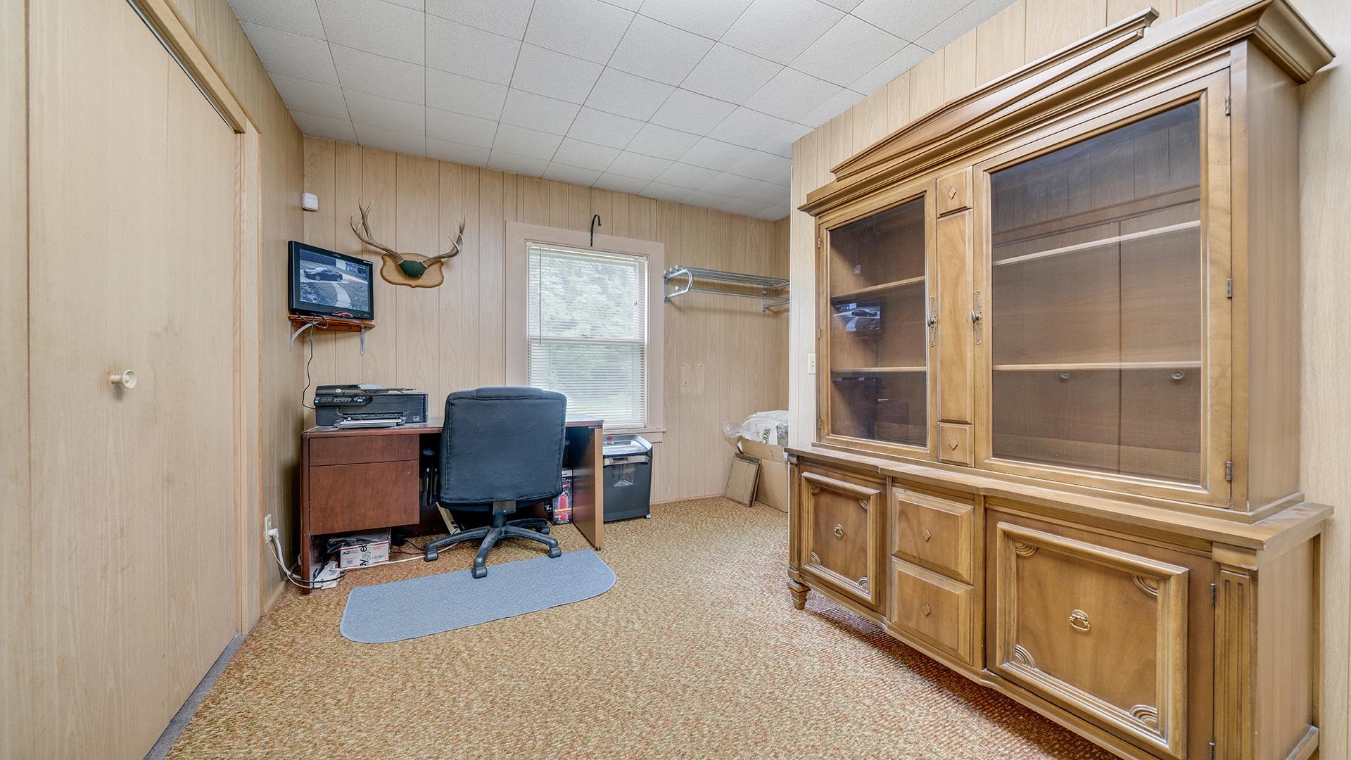 3910 Highway 64 Oregon, IL 61061 - Photo 10 of 53 a view of a workspace with furniture and a window