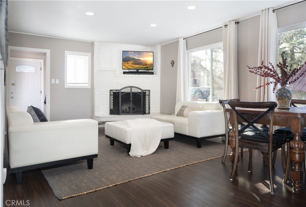 32958 Squirrel Lane Running Springs, CA 92382 - Photo 15 of 40 a living room with furniture and a flat screen tv