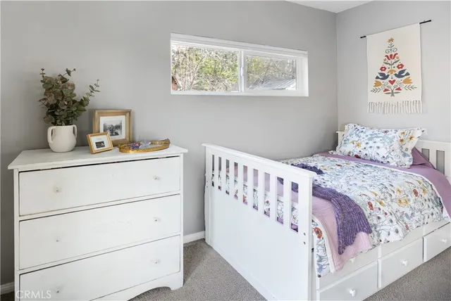 a bedroom with a bed and a table in it