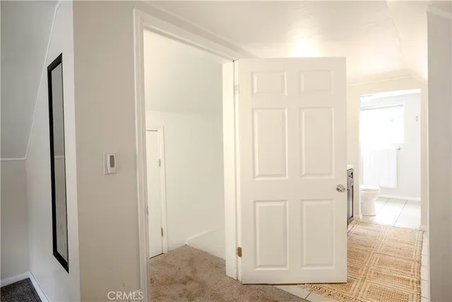 a view of a bathroom with wooden floor