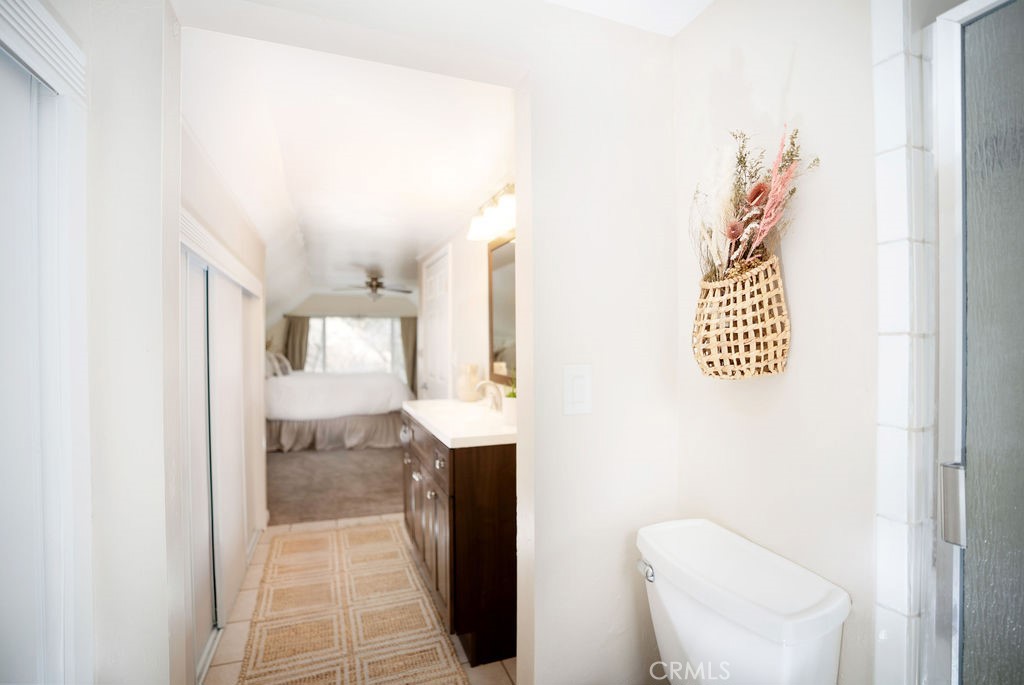 32958 Squirrel Lane Running Springs, CA 92382 - Photo 30 of 40 a bathroom with a toilet sink and mirror