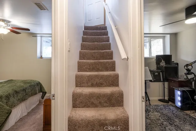 a living room with furniture and a rug
