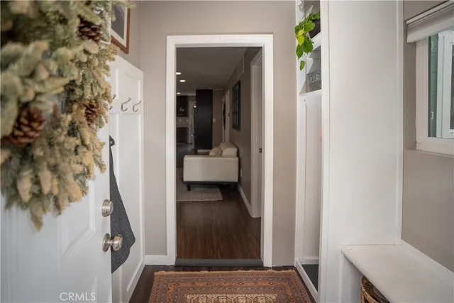 a view of hallway with furniture and stairs