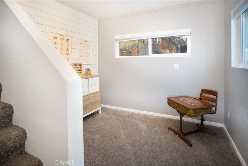 32958 Squirrel Lane Running Springs, CA 92382 - Photo 9 of 40 a room with furniture and a window