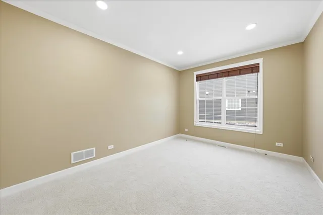 a view of an empty room with a fireplace