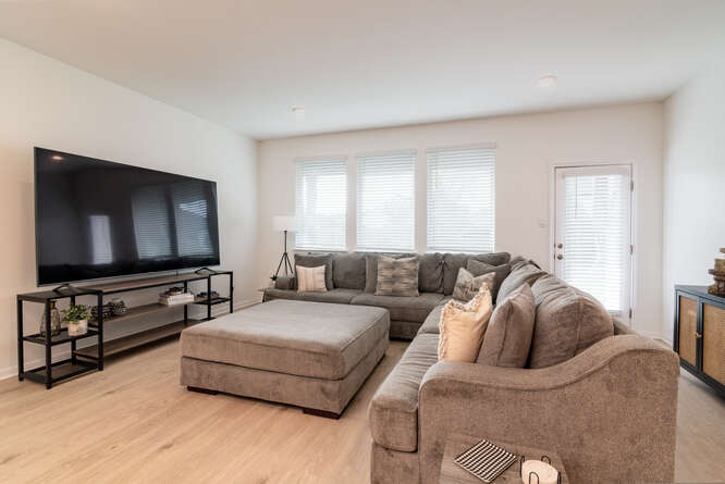 170 Corral Cove Kyle, TX 78640 - Photo 11 of 25 a living room with furniture and a flat screen tv