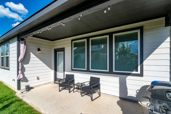 170 Corral Cove Kyle, TX 78640 - Photo 23 of 25 a view of a lounge chair in the back yard of the house