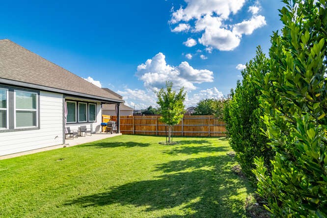 170 Corral Cove Kyle, TX 78640 - Photo 24 of 25 a view of a house with a yard