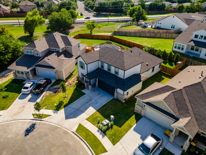 170 Corral Cove Kyle, TX 78640 - Photo 25 of 25 an aerial view of a house with a swimming pool