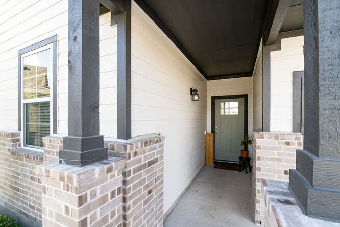 170 Corral Cove Kyle, TX 78640 - Photo 7 of 25 a view of an entryway with wooden floor and windows