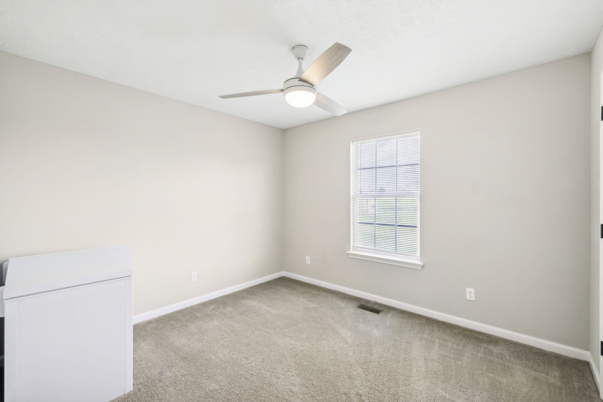 1055 Anderton Road Bell Buckle, TN 37020 - Photo 23 of 51 an empty room with a window and a fan