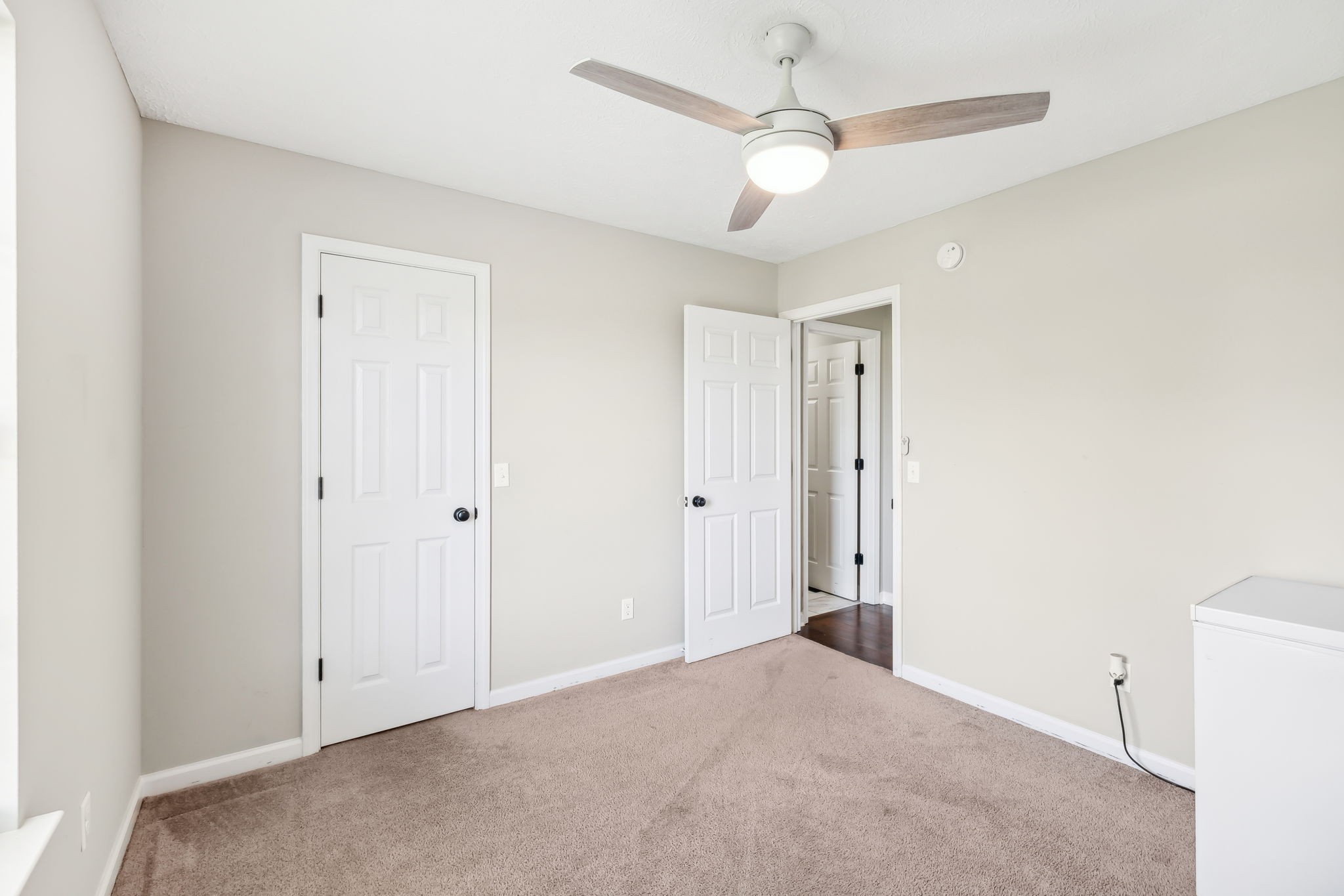 1055 Anderton Road Bell Buckle, TN 37020 - Photo 24 of 51 an empty room with a ceiling fan and a window